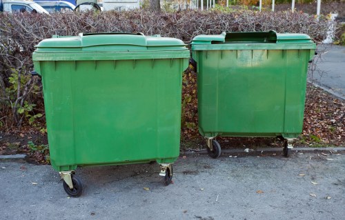 Workers clearing construction waste from a site in Chislehurst